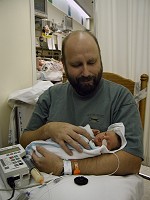 Even daddy can feed - a gadget pushes food through a hose into Tom's stomach