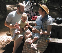 An expedition is resting in a redwood grove