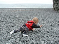 Tommy running over pebbles