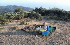 Tommy eats dinner on a lookout