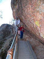 Childen on a bridge over an abyss